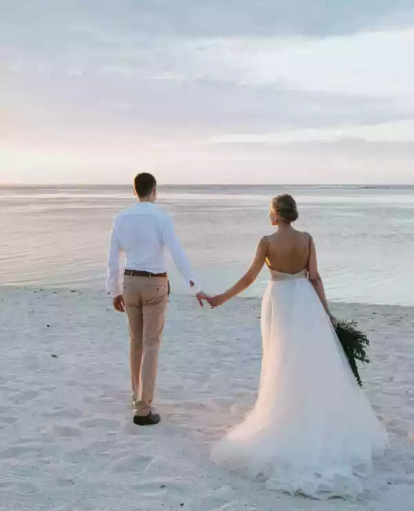 Wedding couple at a white beach in sunset
